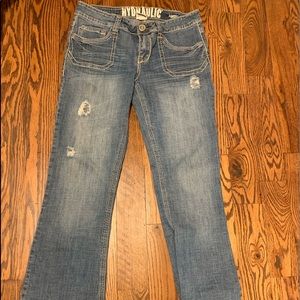 Medium wash hydraulic distressed jeans